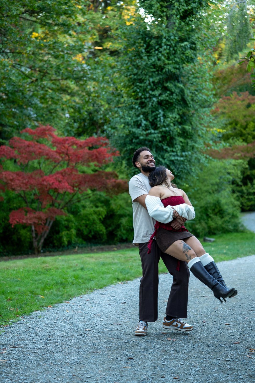 Couple dancing on a garden path